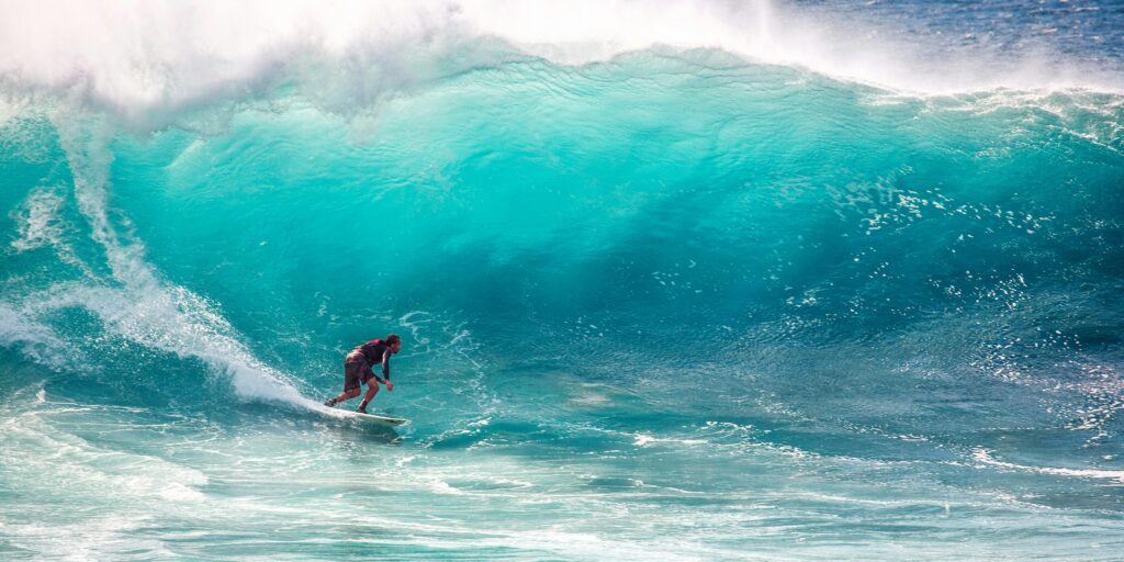 pexels photo 416676 416676 Thrilling surfing on massive turquoise waves, capturing the essence of ocean sports and adventure.